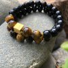Conjunto de duas pulseiras de olho de tigre e Turmalina Negra